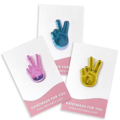 Peace pins in roze, geel en blauw